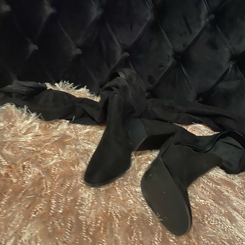 Thigh high black boots